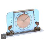 A 1950s Art Deco style pale blue glass mantle clock with gilt fish embellishments, on a chrome base,