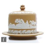 A late 19th to early 20th Century cheese dome and cover decorated in the style of Wedgwood