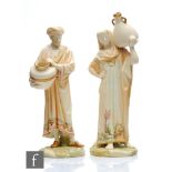 A pair of late 19th Century Royal Worcester blush ivory figures of Egyptian water carriers