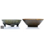 Two Ruskin Pottery bowls, the first decorated in a mottled brown blue glaze, impressed mark and