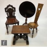 A Victorian carved mahogany shield back hall chair, a poker work spinning chair, a small cross