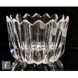 An Orrefors clear glass bowl, of high sided circular form, moulded with vertical triangular