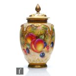 A Royal Worcester Fallen Fruits shape H169 vase and cover panel decorated by Freeman with hand