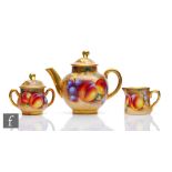 A Royal Worcester Fallen Fruits miniature three piece teaset comprising teapot, milk jug and