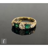 A mid 20th Century 18ct emerald and diamond five stone ring, central diamond weight approximately