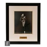 A signed photograph of Lauren Bacall, 24.5cm x 20cm, framed and glazed.