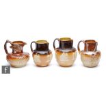 Four assorted 19th and early 20th Century salt glazed stoneware water jugs of varying form,