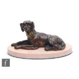 A 20th Century bronze study, modelled as a recumbent spaniel, mounted to an oval marble base, height