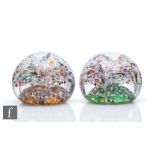 A pair of End of Day Aladdins Cave glass paperweights, internally decorated with layers of