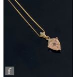 A 9ct hallmarked morganite and diamond pendant, triangular cut claw set morganite below diamond