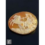 A 9ct mounted oval cameo brooch depicting a horse drawn chariot, weight 12.5g, width 4.5cm,