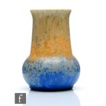 A small Ruskin Pottery crystalline glaze vase of compressed globe and shaft form decorated in an