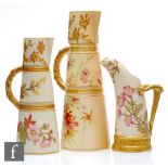 Two late 19th Century Royal Worcester blush ivory conical ewers each decorated with sprays of