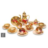 A Royal Worcester Fallen Fruits miniature coffee set comprising coffee pot, milk jug, sugar box