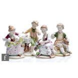 A set of four later 20th Century Unterweissbach figurines modelled as four seated children with