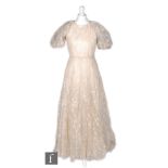 A 1930s ladies vintage full length evening dress, the cream silk underdress with a muslin overlay