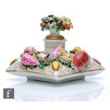 A 19th Century porcelain inkwell decorated with encrusted shells and seaweed with gilt vermicelli