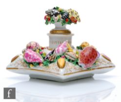 A 19th Century porcelain inkwell decorated with encrusted shells and seaweed with gilt vermicelli
