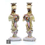 A pair of late 19th Century French Faience candlesticks in the manner of Gien, modelled as