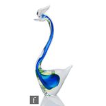 A 20th Century Murano glass sculpture modelled as a stylised bird, internally decorated with blue