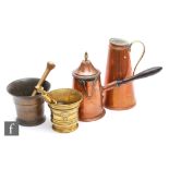 A small bronze mortar with associated brass pestle, height 11cm, a brass pestle and mortar, a copper