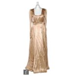 A 1930s/1940s ladies vintage Pre-Raphaelite style full length evening gown in a burnt gold satin