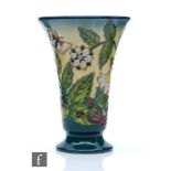 A Moorcroft Pottery trumpet vase decorated in the Fruit Garden pattern designed by Nicola Slaney,