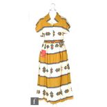 A 1950s ladies vintage dress in cream cotton with printed banded Aztec pattern in yellow, blue and
