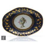 A late 18th Century Worcester oval shaped dish decorated to the central well with a hand painted