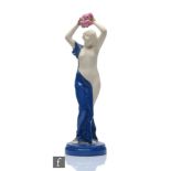 A 1920s Art Deco Royal Worcester Crown Ware figurine modelled as a scantily clad female holding