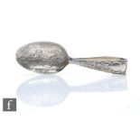 A hallmarked silver spoon from a child's spoon and pusher set impressed with a landscape scene