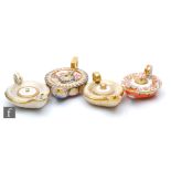 Four 19th Century oil lamps modelled on Roman oil lamps each with gilt and enamel decoration, all