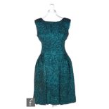 A 1950s/60s ladies vintage dress in sparkly teal and black lurex with high neck and scoop back