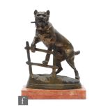 A 20th Century bronzed spelter figure, after C. Valton, modelled as a bull mastiff climbing a fence,
