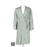 A 1940s lades vintage coat in a duck egg blue corded satin with a black speckled all over print,