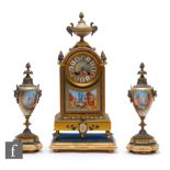 A late 19th Century French clock garniture painted with porcelain panels depicting scenes of Venice,