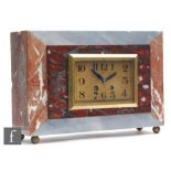 A 1930s French Art Deco grey and brown veined marble mantle clock, Arabic dial named A Guyon Cholet,