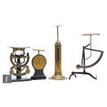 A large Victorian brass pillar postal scales by K W Winford Birmingham, height 34cm, two sets of