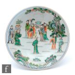A Chinese porcelain famille verte stem cup, the splayed base extending to a circular shallow upper