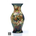 A Moorcroft Pottery vase decorated in the Hellebore pattern designed by Nicola Slaney, impressed