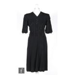 A 1930s/40s ladies vintage dress in black crepe, with panels of diagonal black sequins to the bodice