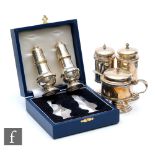 A hallmarked silver cylindrical pedestal cruet set of plain form with a cased baluster salt and