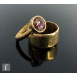 An 18ct wedding of plain form, weight 9g, ring size O, with a gilt metal stone set ring. (2)