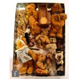 A collection of miniature blond plush teddy bears, some fur covered. (qty)