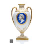 A 19th Century twin handled vase decorated with a cartouche portrait of a classical male in profile,