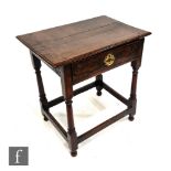 An 18th Century oak side table, the rectangular top with moulded edge above a single frieze drawer