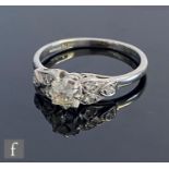 An early 20th Century platinum diamond solitaire ring, old cut claw set stone, weight