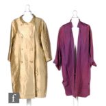 A 1950s/1960s ladies vintage double breasted swing coat in gold satin with matching buttons,