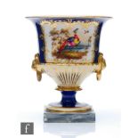 A 19th Century Chamberlain Worcester pedestal urn decorated with a hand painted exotic bird