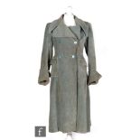 A late 1940s or early 1950s ladies vintage double breasted coat in blue corduroy with deep front